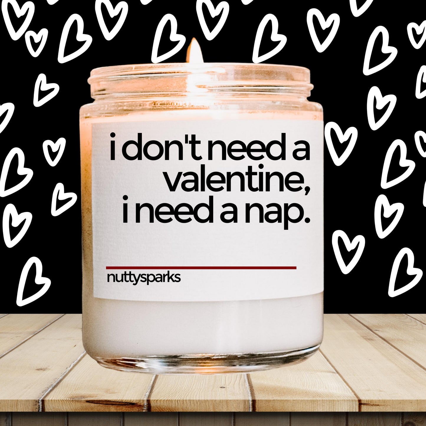 a jar of valentine's day candles sitting on a table
