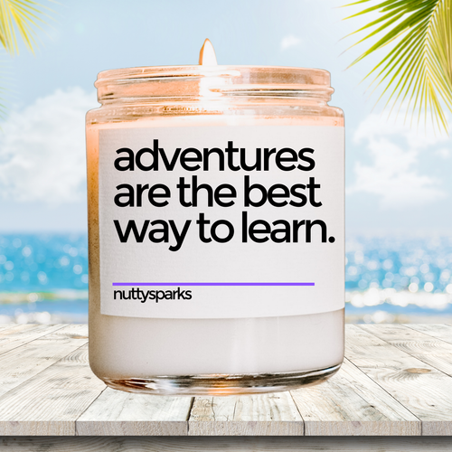 a candle with a quote on it sitting on a table