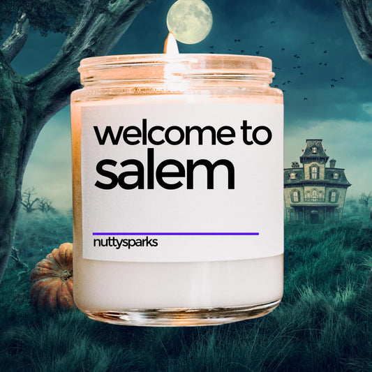 a candle with the words welcome to salem on it