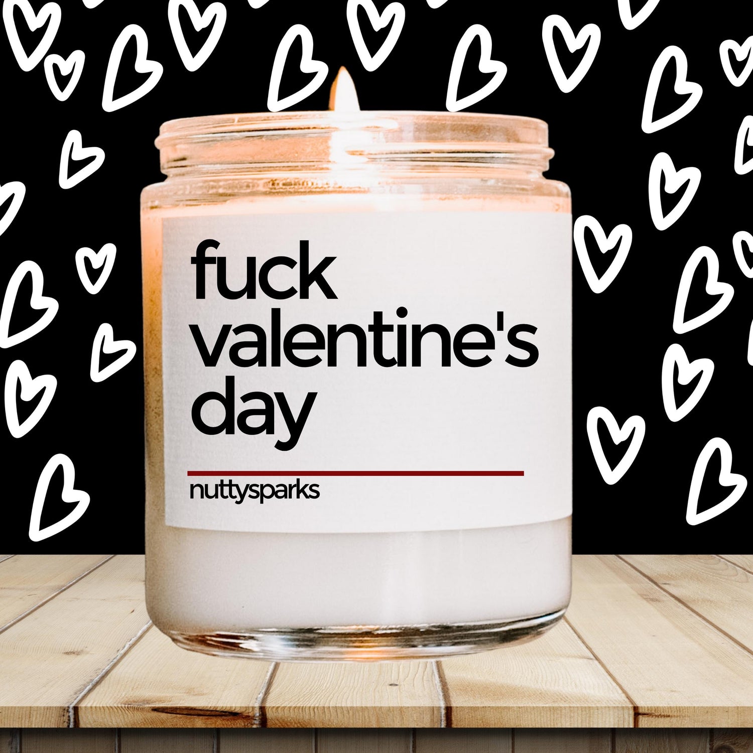 a jar of valentine&#39;s day candles sitting on a table