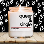 a candle with the words queen and single on it
