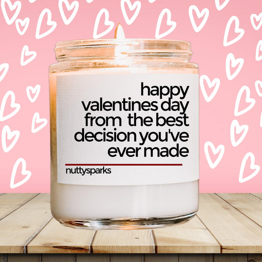 a jar of valentine's day candles sitting on a table