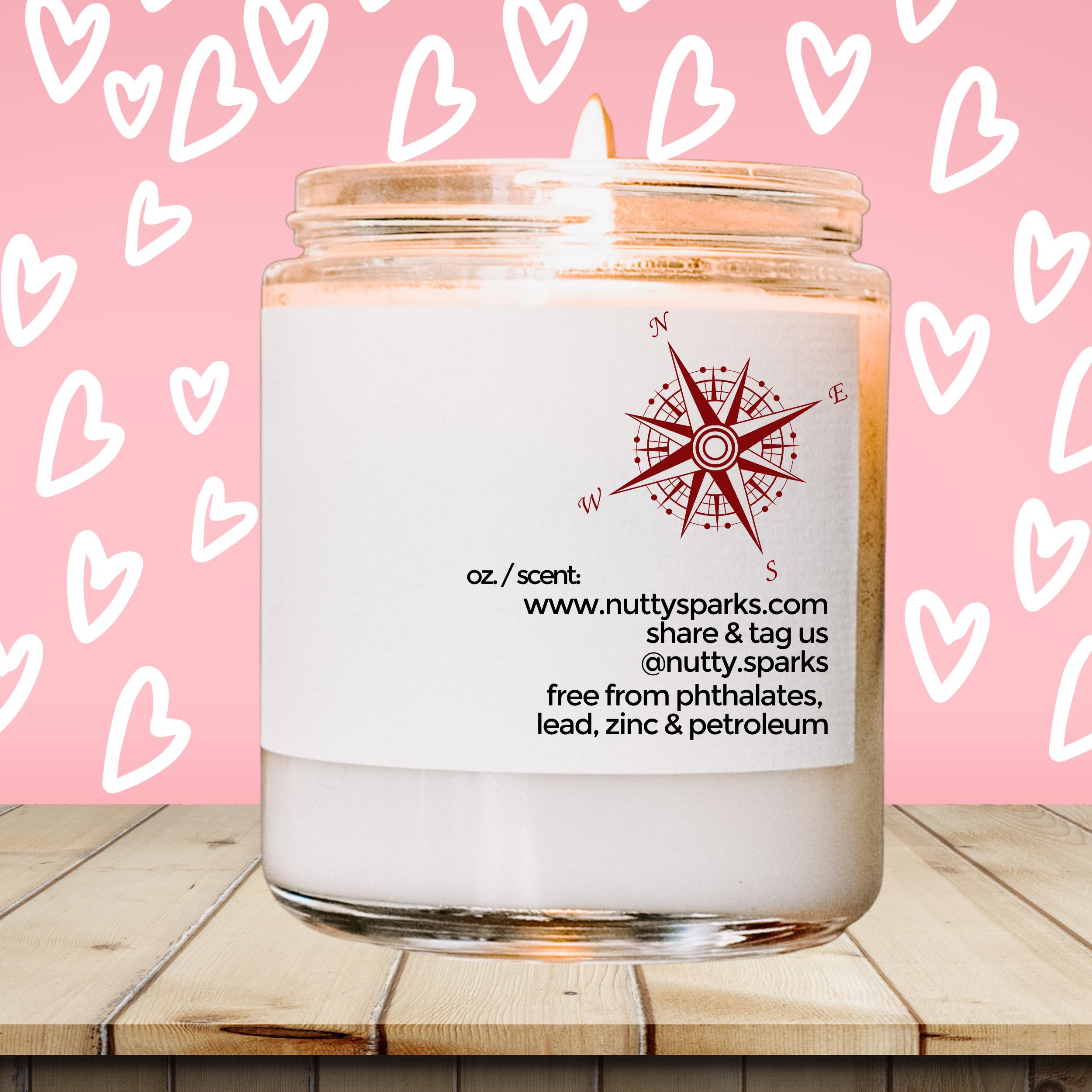 a white candle with a pink background with hearts