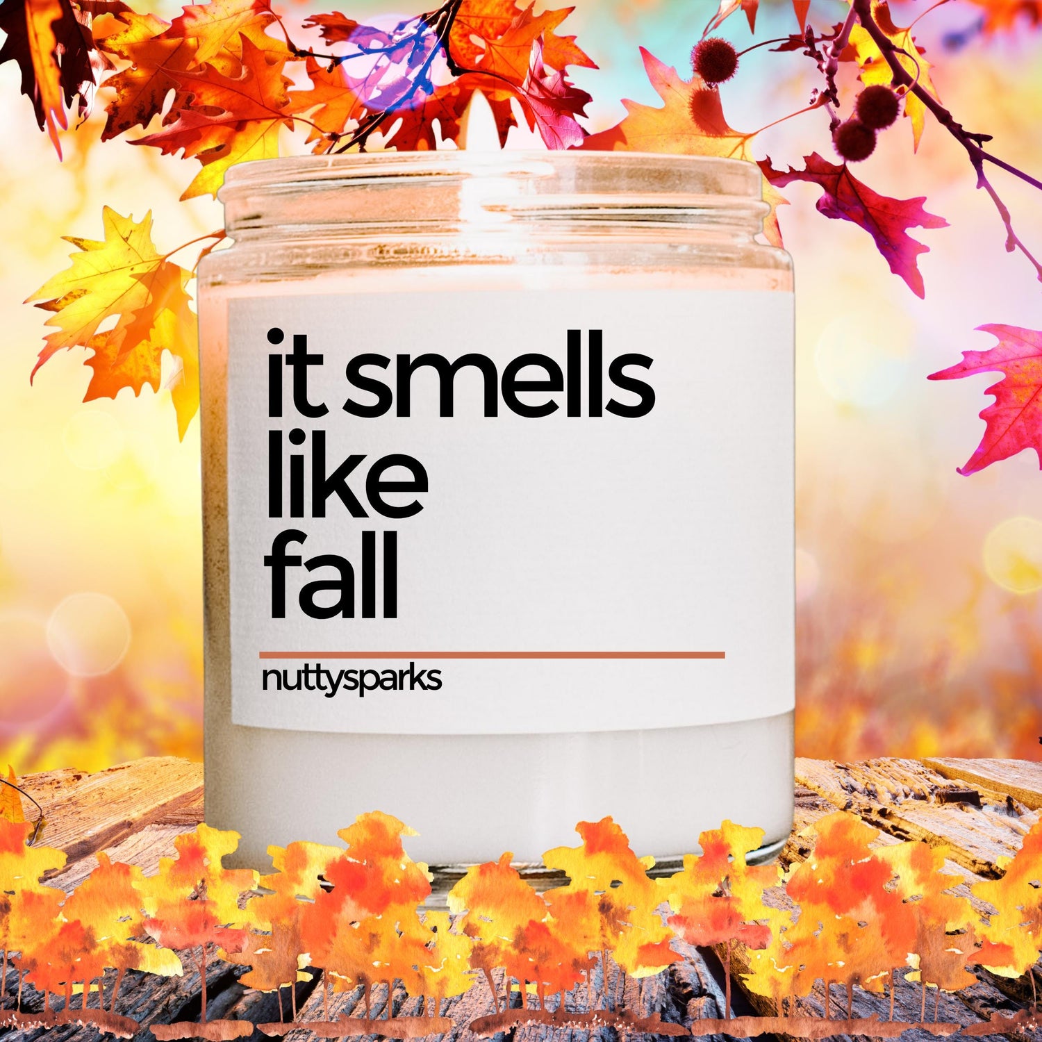 a jar of it smells like fall surrounded by fall leaves