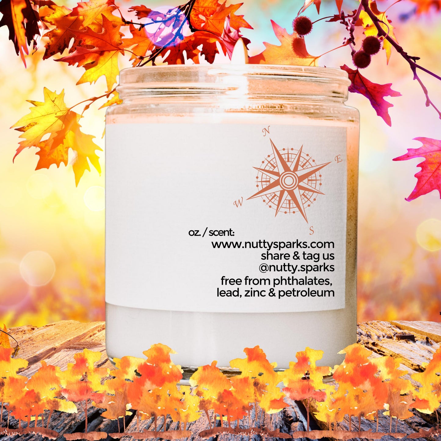 a candle with a quote on it surrounded by autumn leaves