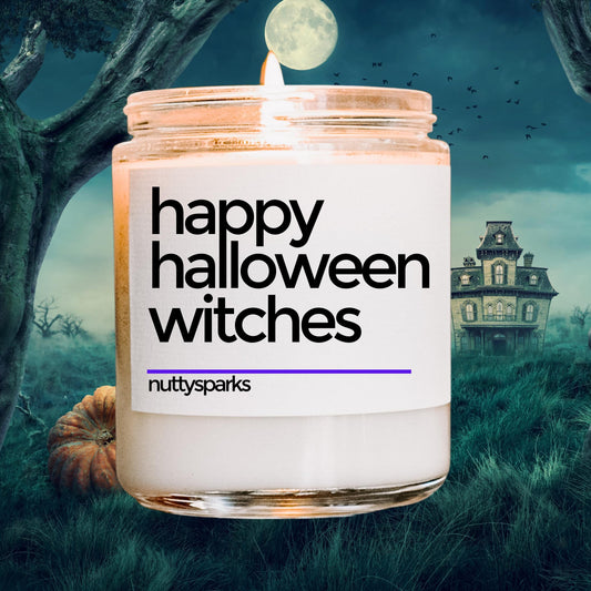 a jar of happy halloween witches candles in front of a spooky house