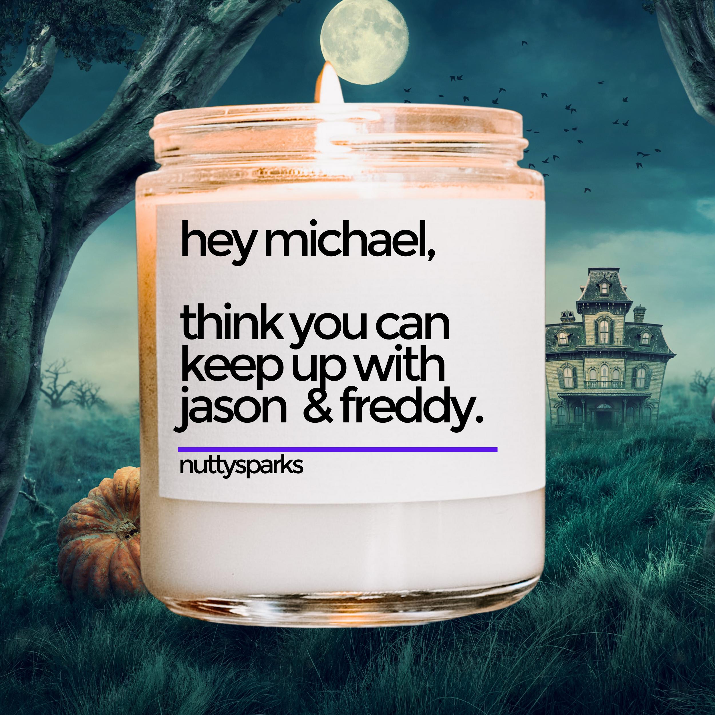 a candle with a picture of a house in the background