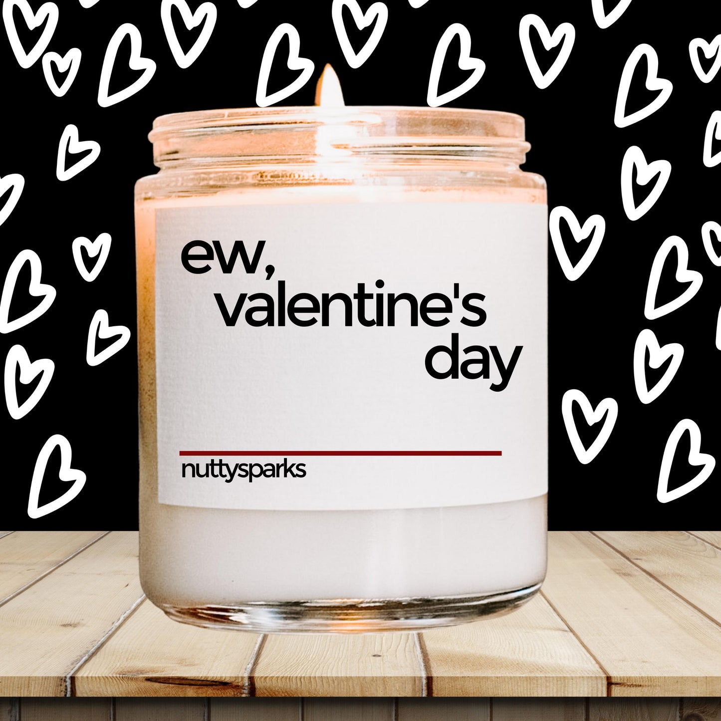 a jar of valentine&#39;s day candles sitting on a table