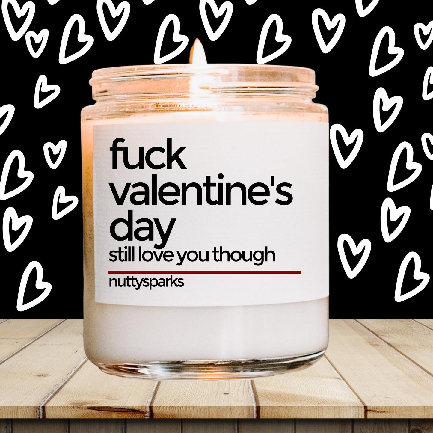 a jar of valentine&#39;s day candles sitting on a table