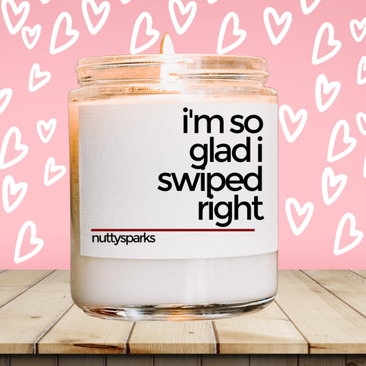 a jar of i&#39;m so glad i ripped right candle on a wooden table