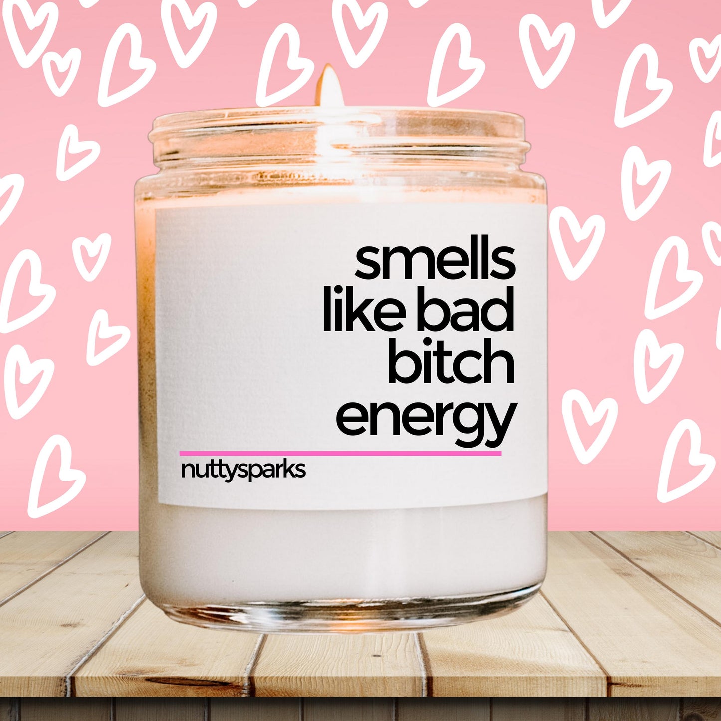 a glass jar with a label on it that says smells like bad bitch energy