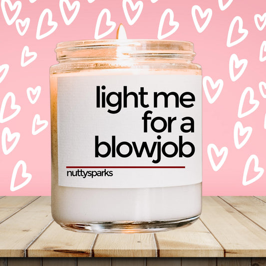 a jar of light me for a blowjob on a wooden table